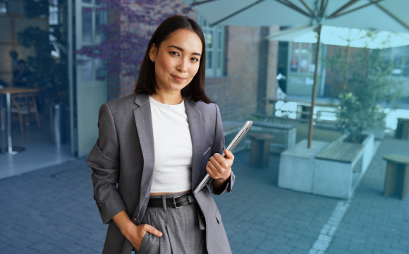 Lease manager outside in front of outdoor dining