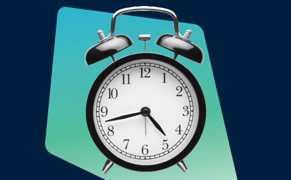 a traditional black alarm clock 
