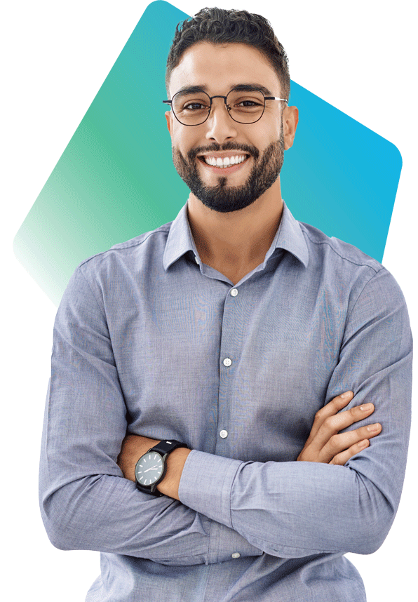 Male lease administrator with glasses and beard smiles confidently with his arms crossed. 